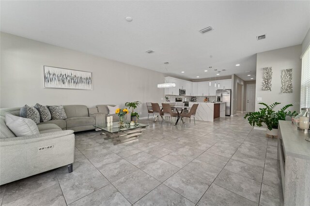 11162 Hanlon Terrace Aly, Winter Garden, FL 34787 - living area featuring recessed lighting, light tile patterned floors, and visible vents
