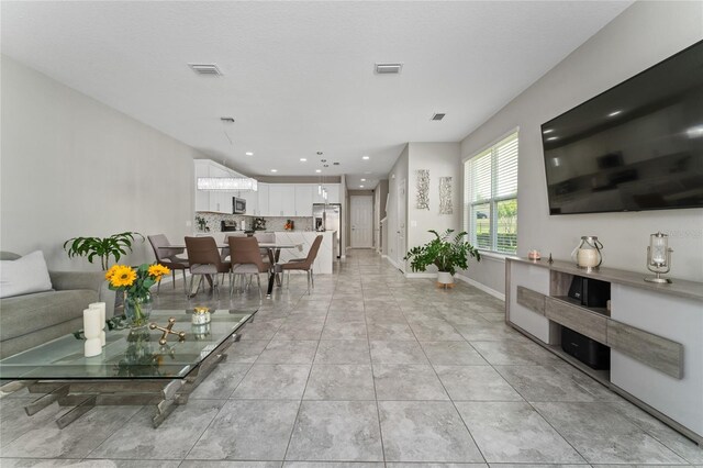 11162 Hanlon Terrace Aly, Winter Garden, FL 34787 - living area featuring baseboards, visible vents, and recessed lighting