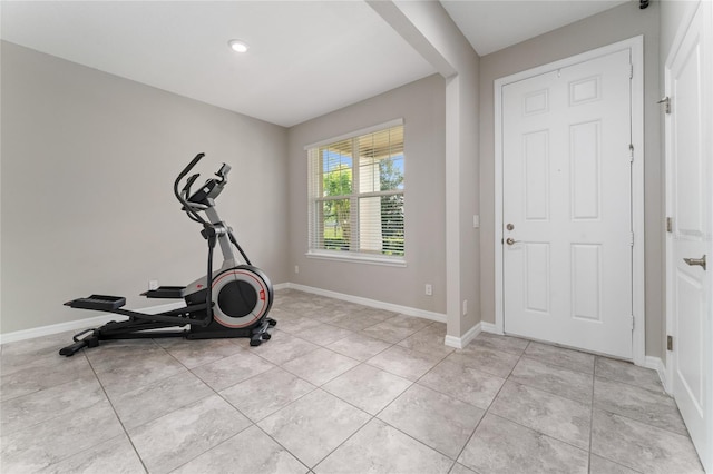 11162 Hanlon Terrace Aly, Winter Garden, FL 34787 - exercise room featuring light tile patterned floors and baseboards