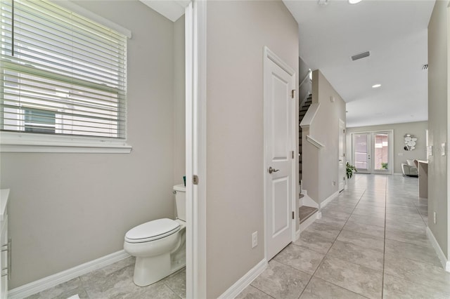 11162 Hanlon Terrace Aly, Winter Garden, FL 34787 - bathroom featuring tile patterned flooring, visible vents, baseboards, and toilet