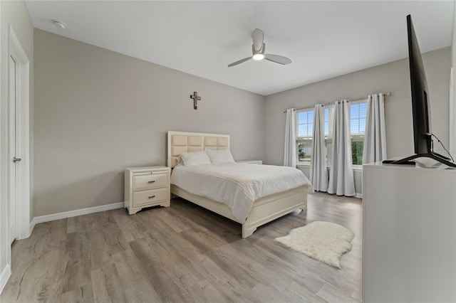11162 Hanlon Terrace Aly, Winter Garden, FL 34787 - bedroom with baseboards, ceiling fan, and light wood-style floors