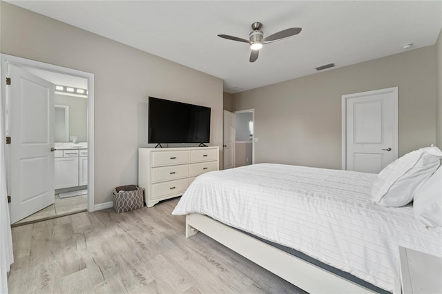 11162 Hanlon Terrace Aly, Winter Garden, FL 34787 - bedroom featuring light wood-type flooring, ensuite bath, a ceiling fan, visible vents, and baseboards