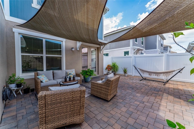 11162 Hanlon Terrace Aly, Winter Garden, FL 34787 - view of patio / terrace with outdoor lounge area, fence, and french doors