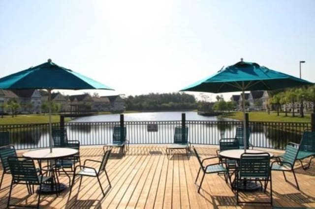 wooden terrace with a water view