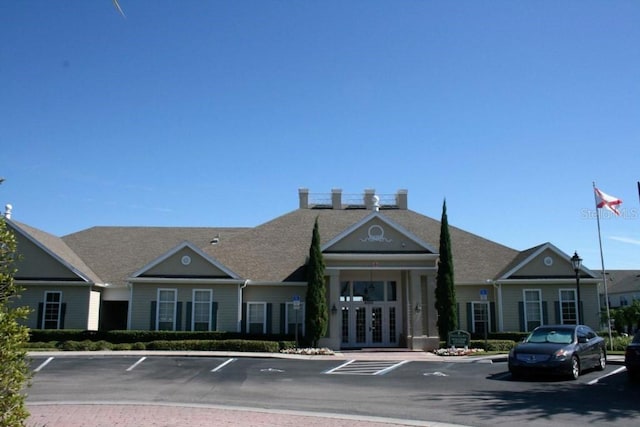 view of property featuring uncovered parking
