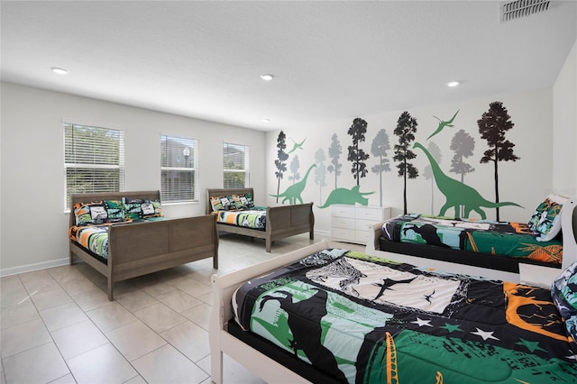 bedroom with recessed lighting, visible vents, baseboards, and light tile patterned flooring