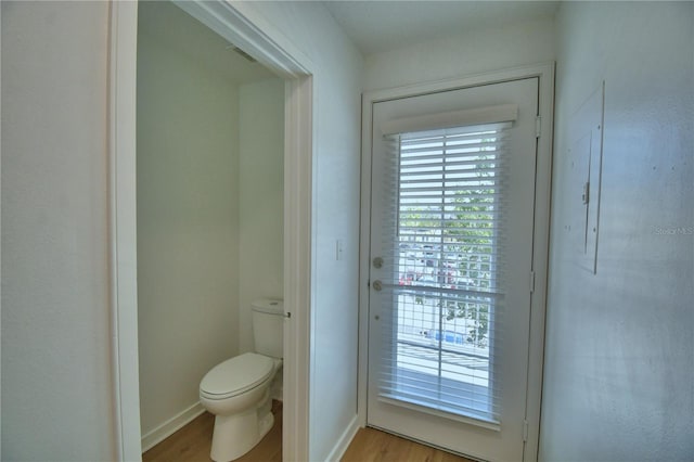 660 Celebration Ave Unit 240, Kissimmee, FL 34747 - doorway to outside featuring visible vents and light wood-style floors