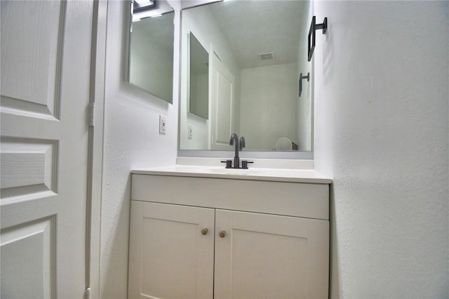 660 Celebration Ave Unit 240, Kissimmee, FL 34747 - bathroom featuring visible vents and vanity