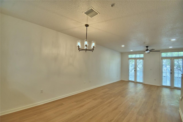 660 Celebration Ave Unit 240, Kissimmee, FL 34747 - spare room featuring baseboards, a textured ceiling, visible vents, and light wood-type flooring