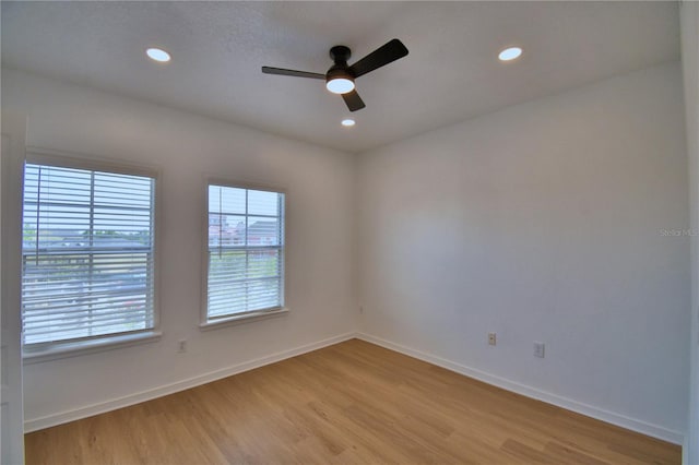 660 Celebration Ave Unit 240, Kissimmee, FL 34747 - empty room featuring baseboards, light wood-style floors, and ceiling fan