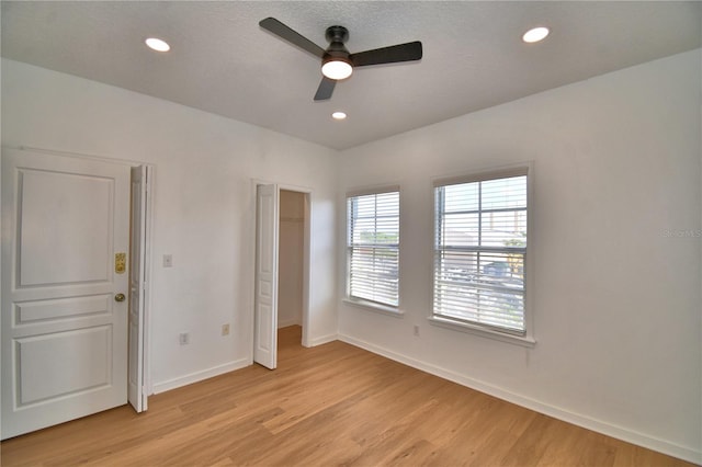 660 Celebration Ave Unit 240, Kissimmee, FL 34747 - unfurnished bedroom featuring recessed lighting, ceiling fan, baseboards, and light wood-type flooring