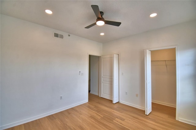 660 Celebration Ave Unit 240, Kissimmee, FL 34747 - unfurnished bedroom with light wood-type flooring, baseboards, visible vents, and recessed lighting