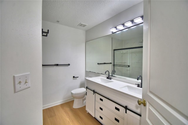660 Celebration Ave Unit 240, Kissimmee, FL 34747 - full bathroom with wood finished floors, a sink, visible vents, and a stall shower