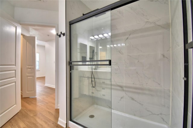 660 Celebration Ave Unit 240, Kissimmee, FL 34747 - full bath with baseboards, wood finished floors, and a stall shower