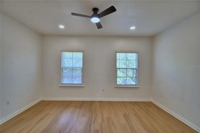 660 Celebration Ave Unit 240, Kissimmee, FL 34747 - spare room with light wood finished floors, a textured ceiling, baseboards, recessed lighting, and a ceiling fan
