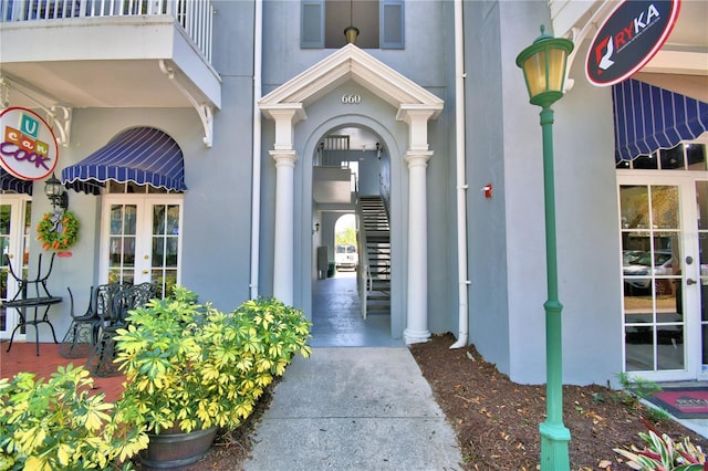 660 Celebration Ave Unit 240, Kissimmee, FL 34747 - property entrance with french doors, visible vents, and stucco siding