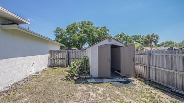 view of shed featuring a fenced backyard