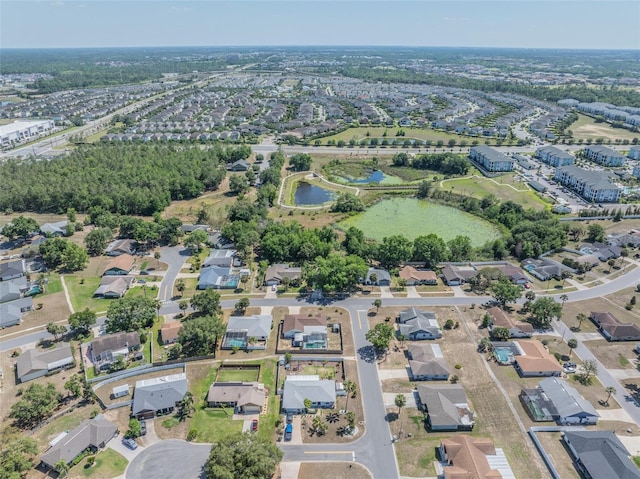 bird's eye view featuring a water view and a residential view