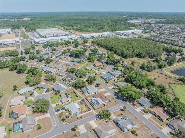 bird's eye view featuring a view of trees and a residential view
