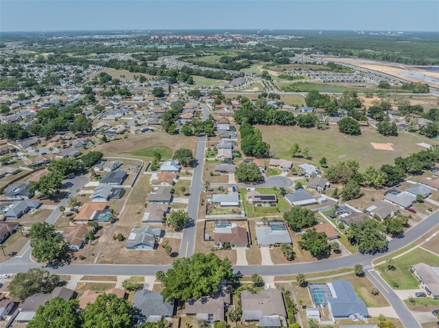 birds eye view of property with a residential view