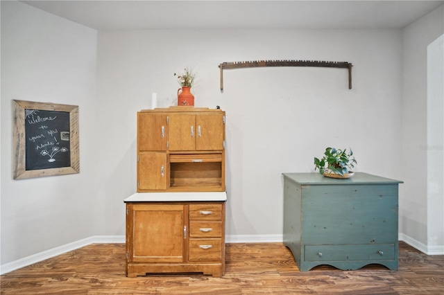 office with baseboards and wood finished floors