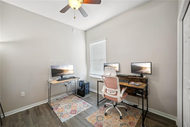 office area featuring baseboards, ceiling fan, and wood finished floors