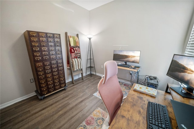 office space featuring baseboards and wood finished floors