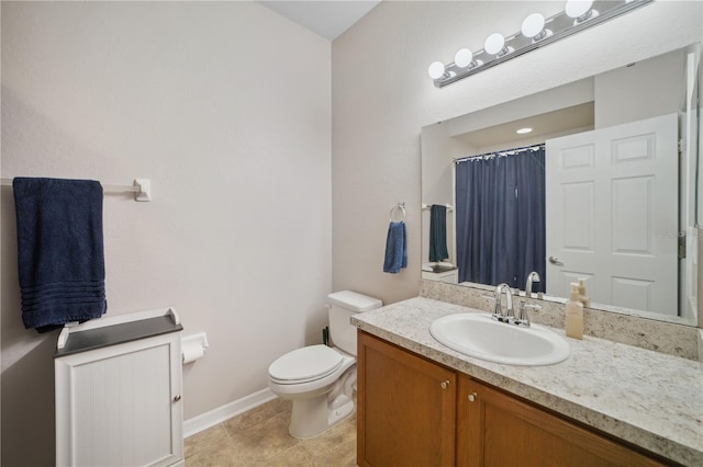 bathroom featuring vanity, toilet, tile patterned floors, baseboards, and a shower with curtain