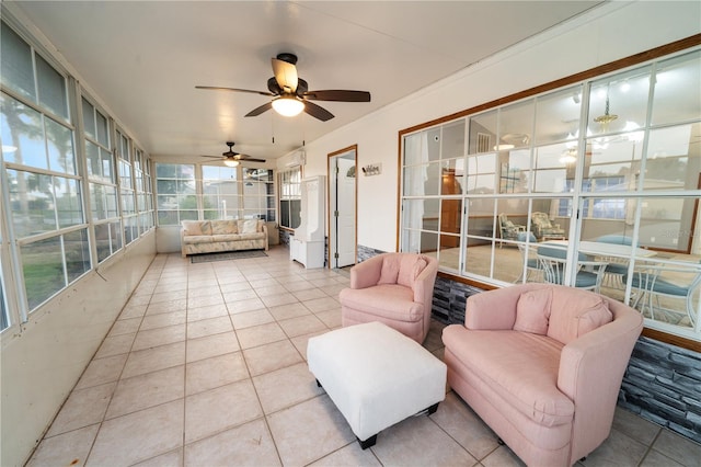 sunroom / solarium featuring outdoor lounge area and a ceiling fan