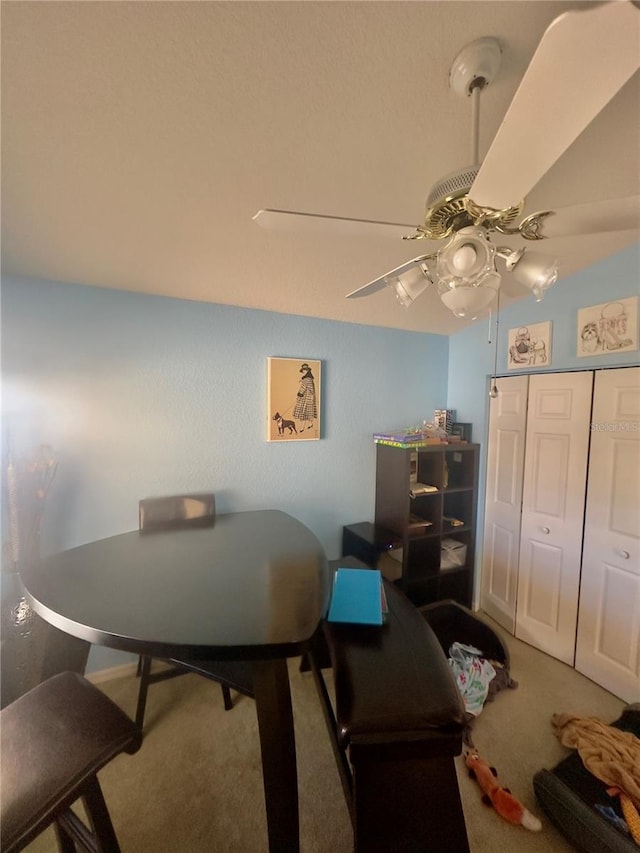 home office with a ceiling fan and carpet floors
