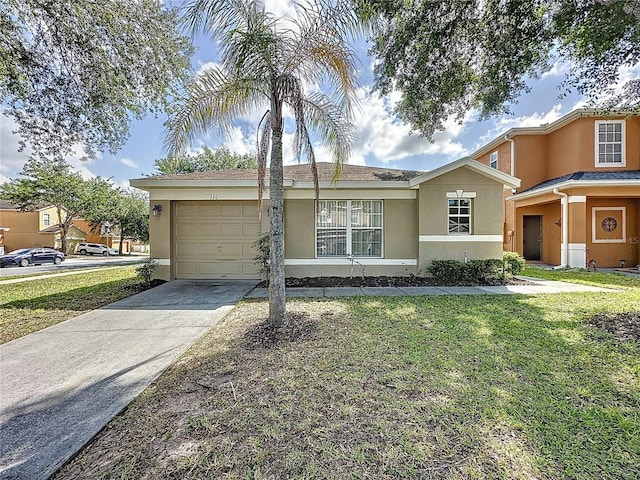 single story home featuring a front yard, an attached garage, concrete driveway, and stucco siding