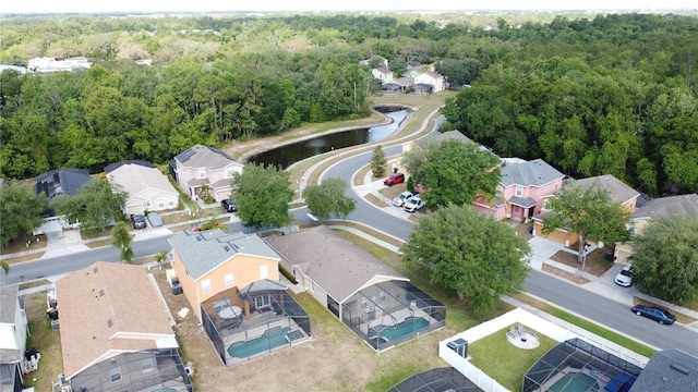 birds eye view of property with a forest view and a residential view
