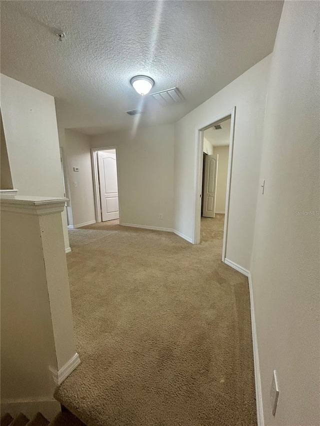 2305 Chatham Place Dr, Orlando, FL 32824 - spare room featuring a textured ceiling, baseboards, and light carpet