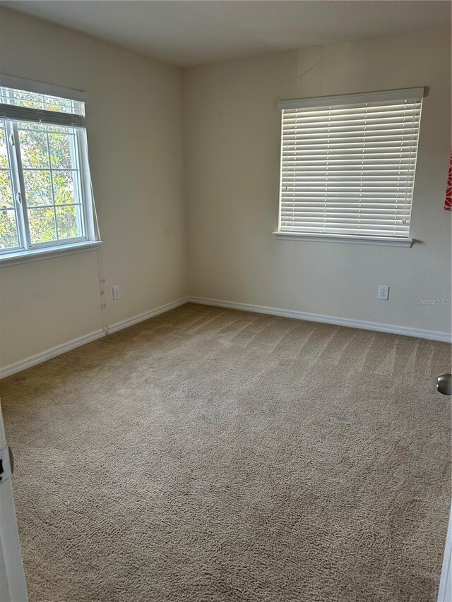 2305 Chatham Place Dr, Orlando, FL 32824 - empty room featuring carpet and baseboards
