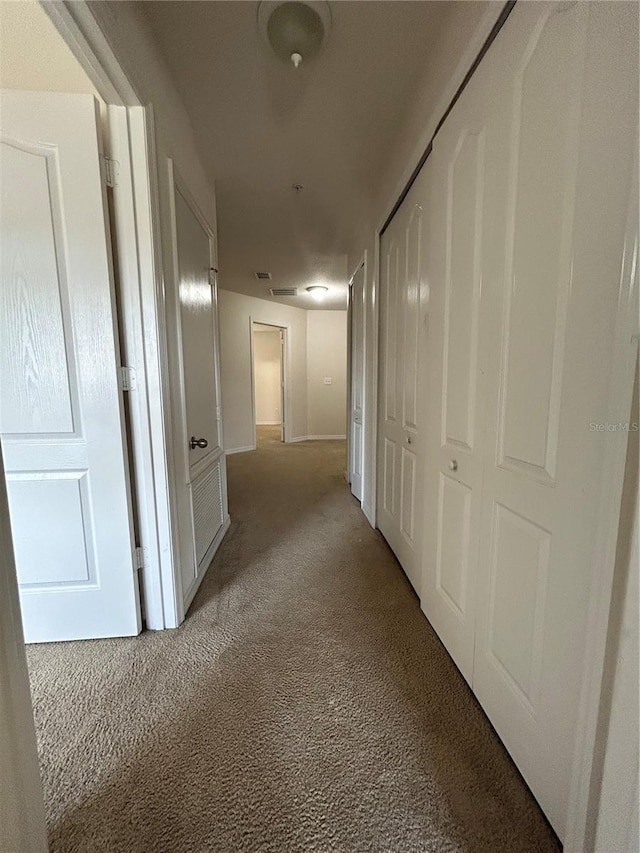 2305 Chatham Place Dr, Orlando, FL 32824 - hallway featuring light carpet and baseboards