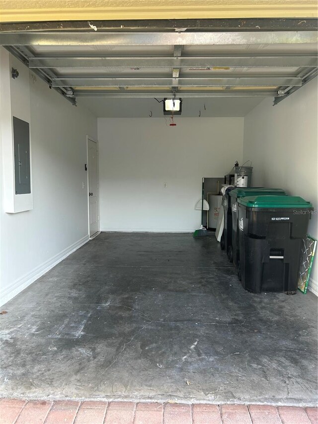 2305 Chatham Place Dr, Orlando, FL 32824 - garage featuring electric panel and a garage door opener