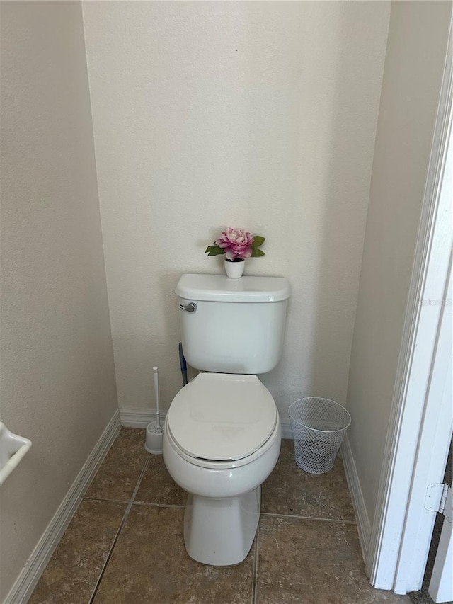 2305 Chatham Place Dr, Orlando, FL 32824 - bathroom with toilet, baseboards, and tile patterned flooring