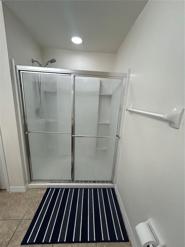 2305 Chatham Place Dr, Orlando, FL 32824 - bathroom featuring a stall shower and baseboards