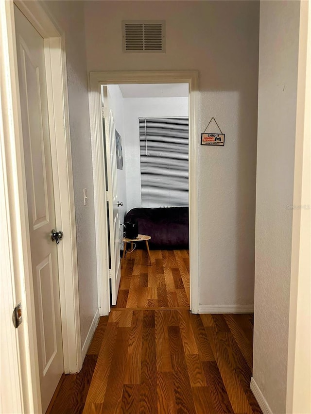 6141 Metrowest Blvd Unit 303, Orlando, FL 32835 - hallway featuring wood finished floors and baseboards