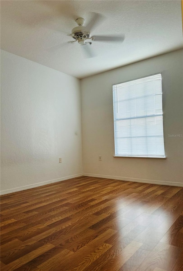 6141 Metrowest Blvd Unit 303, Orlando, FL 32835 - spare room with a ceiling fan and wood finished floors