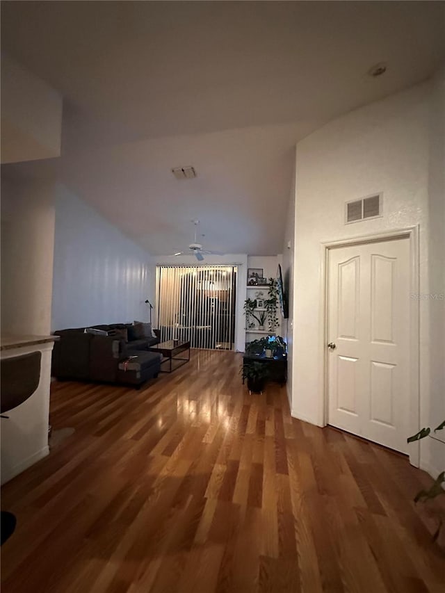 6141 Metrowest Blvd Unit 303, Orlando, FL 32835 - corridor with vaulted ceiling and wood finished floors