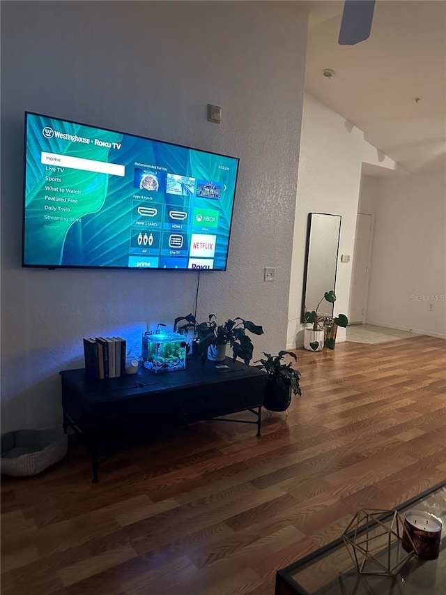 6141 Metrowest Blvd Unit 303, Orlando, FL 32835 - living room with wood finished floors and a textured wall