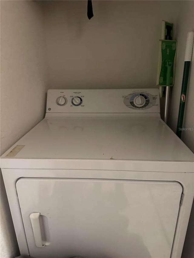 6141 Metrowest Blvd Unit 303, Orlando, FL 32835 - laundry area with washer / dryer