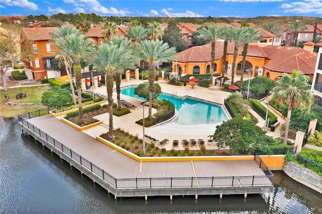 6141 Metrowest Blvd Unit 303, Orlando, FL 32835 - back of property with a community pool, a water view, and a patio area