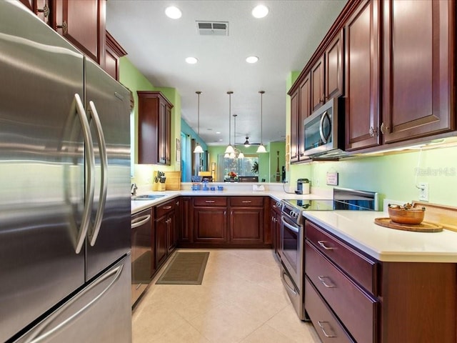 2724 Palm Tree Dr, Poinciana, FL 34759 - kitchen with visible vents, recessed lighting, appliances with stainless steel finishes, and hanging light fixtures