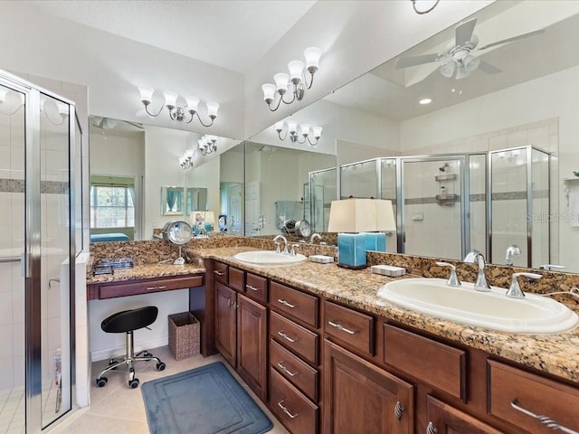 2724 Palm Tree Dr, Poinciana, FL 34759 - bathroom with double vanity, a shower stall, ceiling fan, and a sink