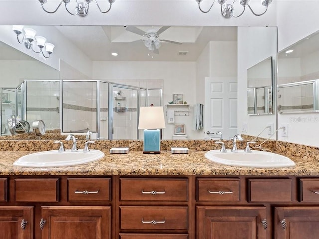 2724 Palm Tree Dr, Poinciana, FL 34759 - bathroom with a ceiling fan, a sink, a shower stall, and double vanity