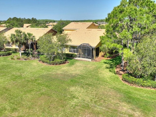 2724 Palm Tree Dr, Poinciana, FL 34759 - exterior space featuring a lawn and glass enclosure