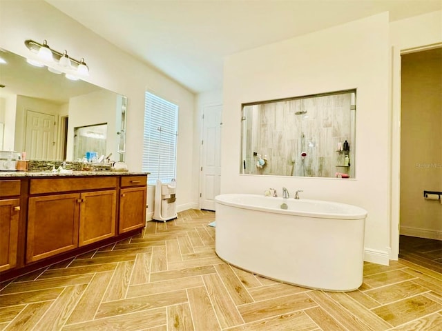 5019 Down Ct, Saint Cloud, FL 34772 - full bathroom featuring baseboards, a freestanding tub, vanity, and a tile shower