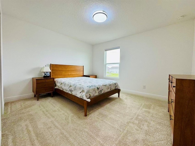 5019 Down Ct, Saint Cloud, FL 34772 - bedroom featuring baseboards, light colored carpet, and a textured ceiling